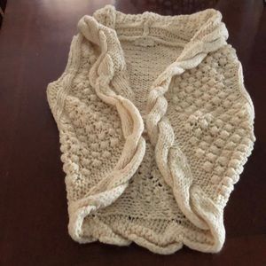 Cream colored knitted vest